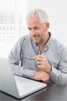 Man looking at short term insurance on his laptop